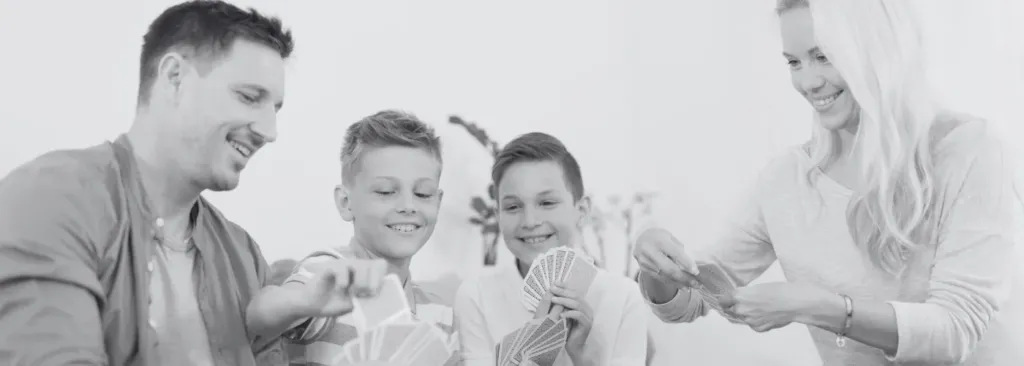 old photo of a family playing card game