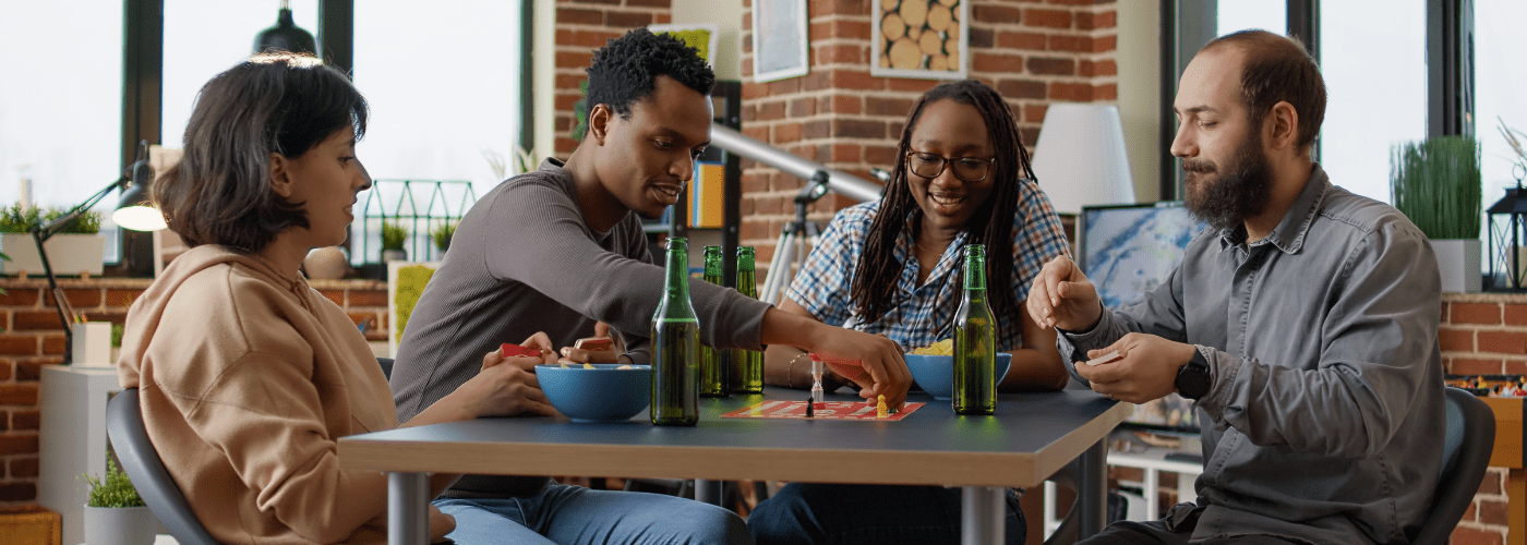 people playing board game Why Board Game and Card Game Nights are Making a Comeback